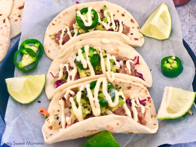 Delight your friends with these delicious Asian Style Tuna Tacos. Marinated ahi tuna is served over an asian slaw, avocados, and covered with spicy mayo.