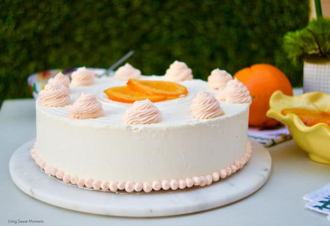 This amazing Succulent Orange Curd Cake consists of 3 layers of moist orange cake filled with orange curd and topped with Swiss vanilla buttercream.