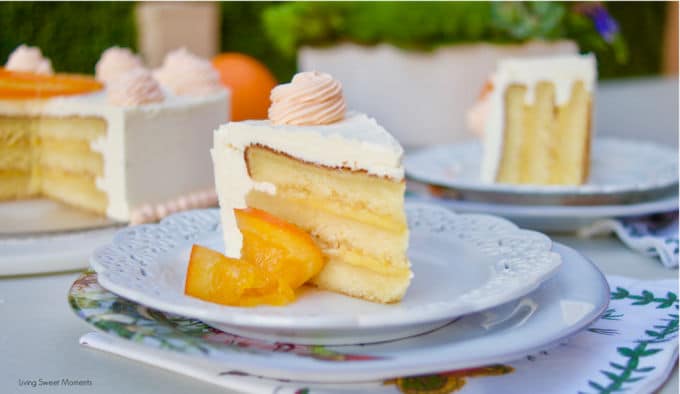 This amazing Succulent Orange Curd Cake consists of 3 layers of moist orange cake filled with orange curd and topped with Swiss vanilla buttercream.