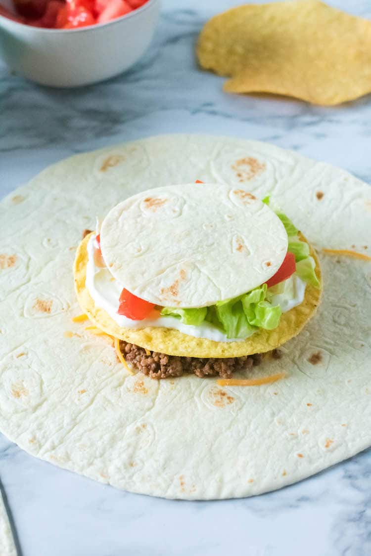 Skip the drive thru lane and enjoy a delicious meal at home. This Copycat Taco Bell Crunch Wrap recipe is easy to make, healthier and ready in no time.