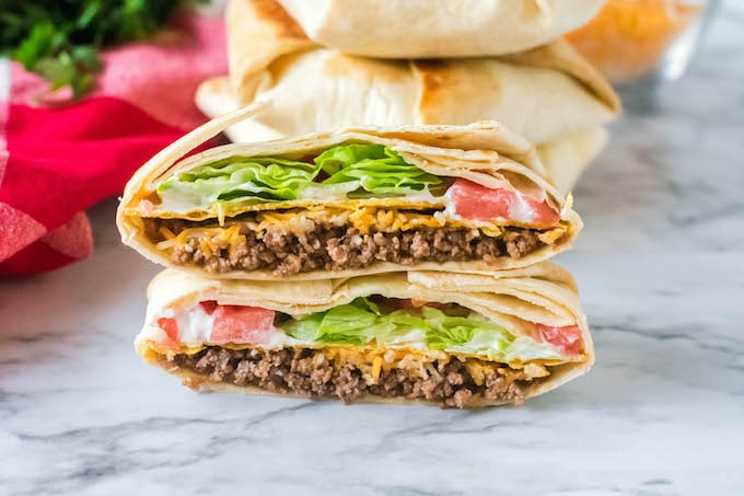 Skip the drive thru lane and enjoy a delicious meal at home. This Copycat Taco Bell Crunch Wrap recipe is easy to make, healthier and ready in no time.  