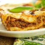 This Authentic Italian Lasagna Recipe made is by layering noodles with bolognese sauce, cheese, and bechamel. Delicious for dinner and celebrations.