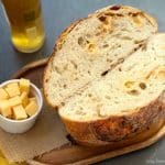 Bake this Beer Gouda Onion Sourdough Bread, a flavorful, advanced loaf with caramelized onions, gooey cheese, and beer for the perfect bite