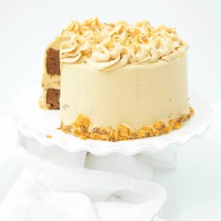 This delicious Butterfinger Cake Recipe dessert is made from scratch and features a moist chocolate cake with peanut butter frosting and butterfingers.