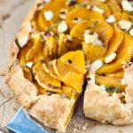 Butternut Squash Galette with caramelized onions, creamy goat cheese, and a flaky buttery crust. Perfect for fall gatherings and Thanksgiving!