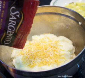 These amazing Cheese Stuffed Yuca Balls are crispy, delicate, and so cheesy! Served with a cilantro aioli. Perfect as bite-size appetizers for entertaining. Shows bowl pouring cheese