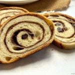 Cinnamon Raisin Sourdough Bread with a gooey cinnamon-sugar swirl and juicy raisins. Easy overnight method, timeline, tools, variations + fix