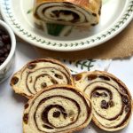 Cinnamon Raisin Sourdough Bread with a gooey cinnamon-sugar swirl and juicy raisins. Easy overnight method, timeline, tools, variations + fix