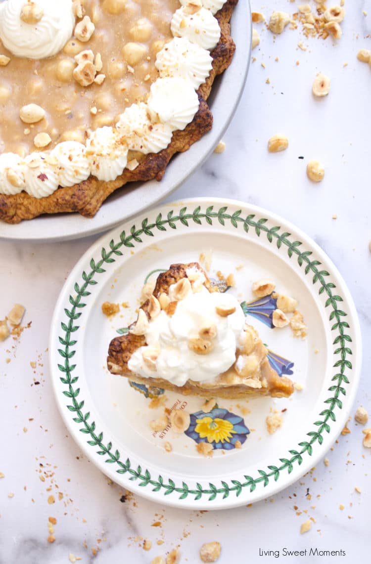 Elevate your Thanksgiving table with this delicious Hazelnut Praline Pumpkin Pie served on a flaky homemade crust 