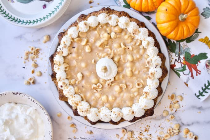 Elevate your Thanksgiving table with this delicious Hazelnut Praline Pumpkin Pie served on a flaky homemade crust 