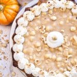 Elevate your Thanksgiving table with this delicious Hazelnut Praline Pumpkin Pie served on a flaky homemade crust 