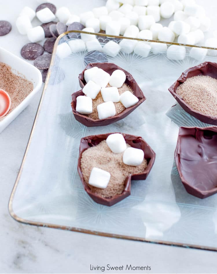 When you pour hot milk over these hot chocolate bombs, they melt and magically release the coffee, marshmallows, and cocoa hiding inside.