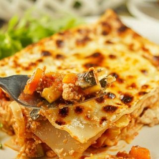 This hearty Low Fat Vegetarian Lasagna Recipe is packed with veggies in a delicious tomato sauce. The perfect weeknight dinner idea that everyone will love.