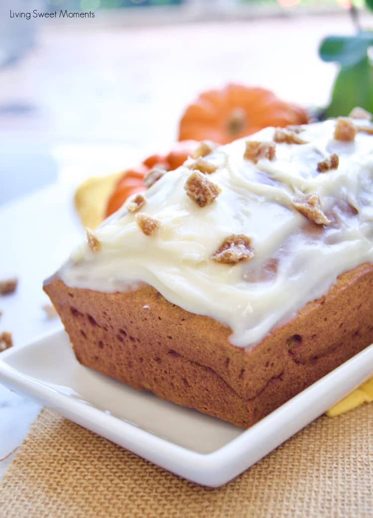 This delicious and moist pumpkin loaf recipe is topped with tangy cream cheese frosting and crystallized ginger pieces. It's perfect for breakfast, snack, or dessert! 