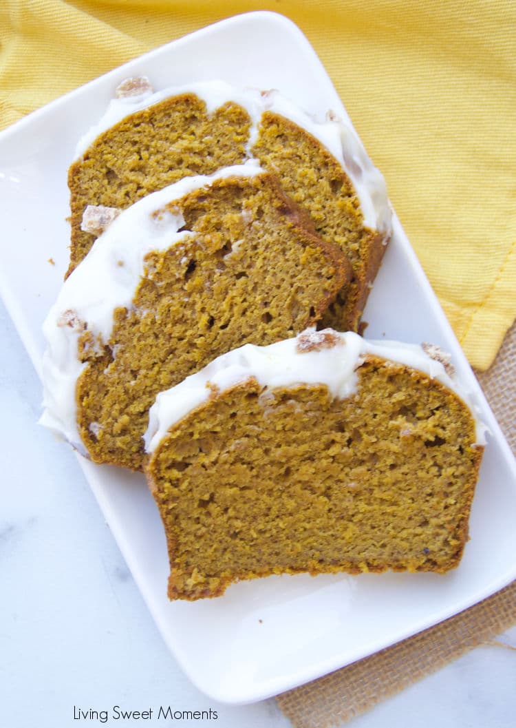 This delicious and moist pumpkin loaf recipe is topped with tangy cream cheese frosting and crystallized ginger pieces. It's perfect for breakfast, snack, or dessert! 