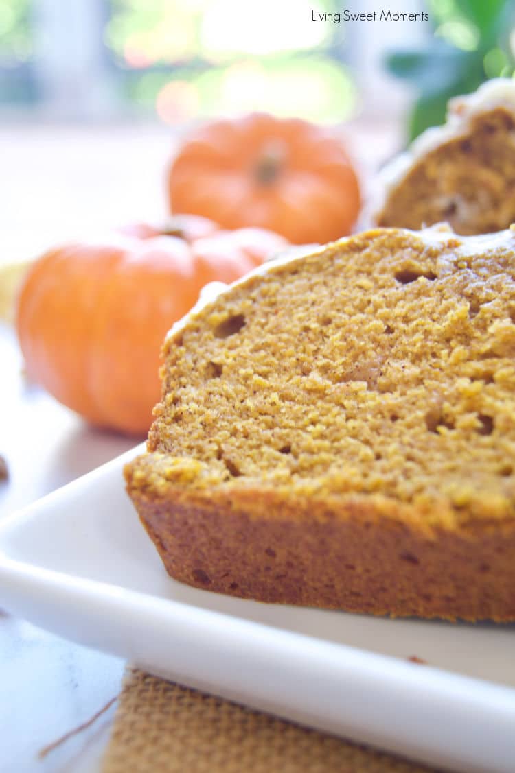 This delicious and moist pumpkin loaf recipe is topped with tangy cream cheese frosting and crystallized ginger pieces. It's perfect for breakfast, snack, or dessert! 