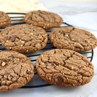 This delicious Nutella Chocolate Chip Cookie Recipe is easy to make with its rich cookie dough filled with Nutella, chocolate chips and chopped hazelnuts then baked to perfection