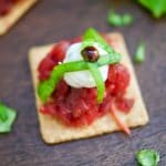 A delicious an easy appetizer! These Roasted Beet and Goat Cheese Crackers are garnished with fresh basil and balsamic vinegar reduction.