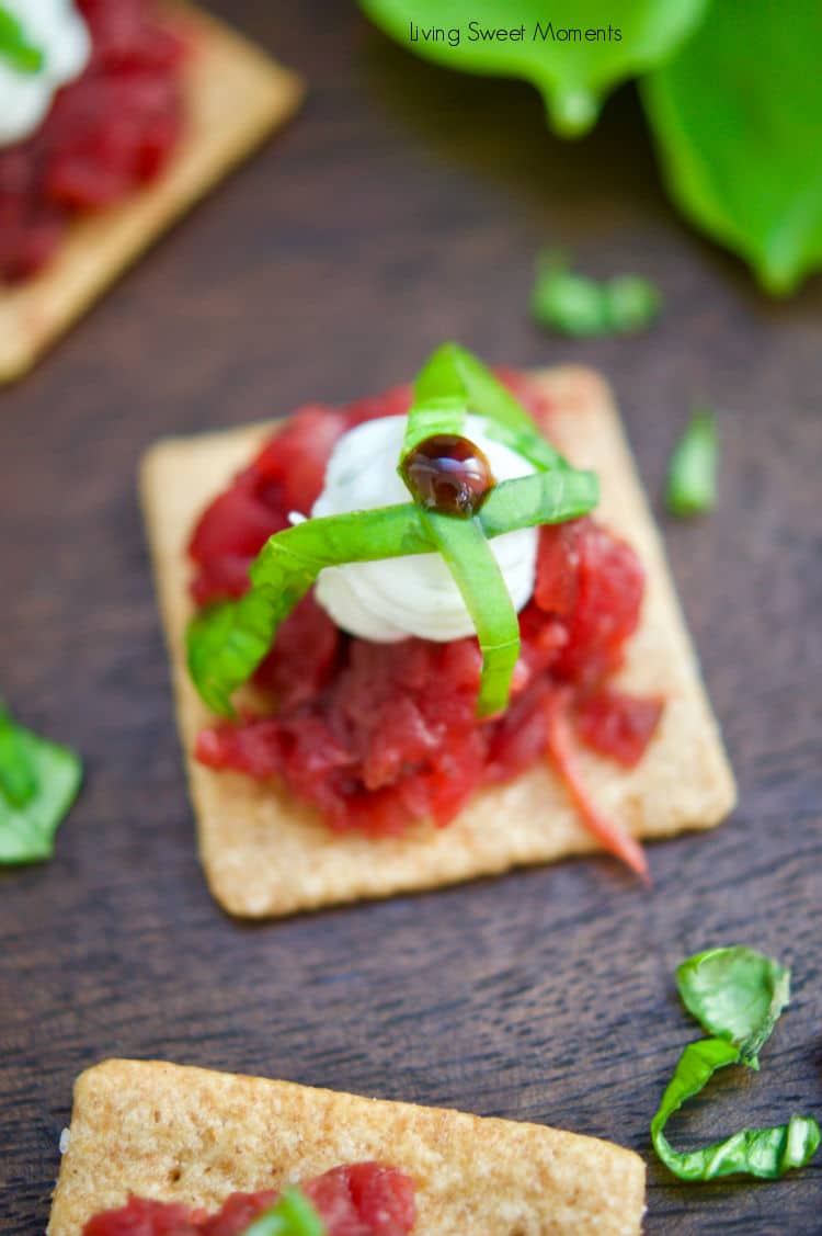 A delicious an easy appetizer! These Roasted Beet and Goat Cheese Crackers are garnished with fresh basil and balsamic vinegar reduction.