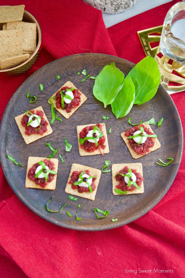 A delicious an easy appetizer! These Roasted Beet and Goat Cheese Crackers are garnished with fresh basil and balsamic vinegar reduction.
