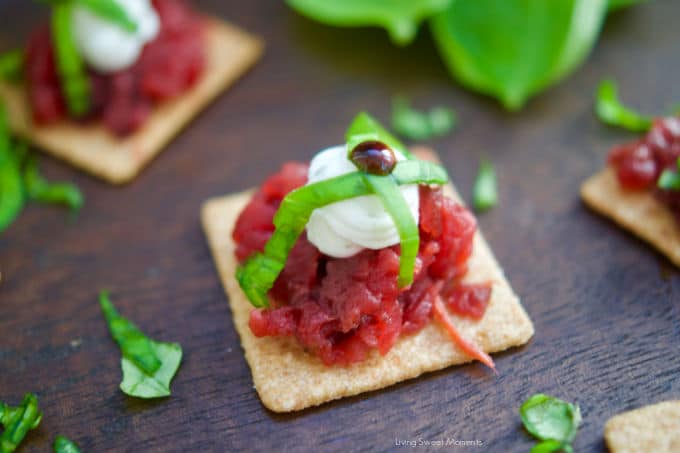 A delicious an easy appetizer! These Roasted Beet and Goat Cheese Crackers are garnished with fresh basil and balsamic vinegar reduction.