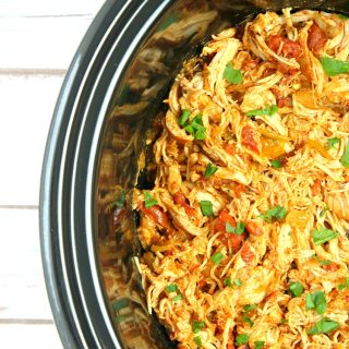 You won't believe how easy these Slow Cooker Shredded Chicken Tacos are to make. Serve in a warm tortilla with cheese, veggies, and sour cream
