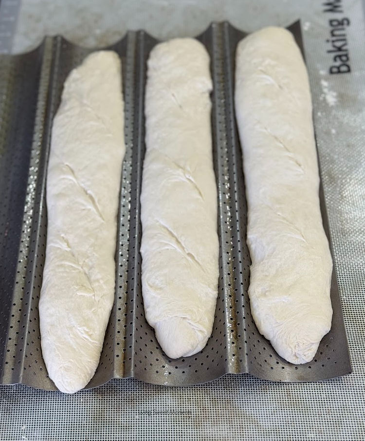 Crispy crust, airy crumb, and tangy flavor! This sourdough baguette recipe makes bakery-style bread at home with an easy overnight ferment