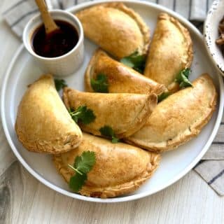 Sourdough discard empanadas are golden, flaky, and perfect for parties & make-ahead meals. Easy fillings, sauces & freezer-friendly tips!