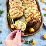 Soft, garlicky, cheesy sourdough pull-apart bread with golden layers, easy, cozy, and perfect for sharing or pairing with soups.
