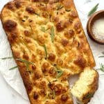 Bake this fluffy, golden sourdough focaccia recipe with olive oil and herbs. Crispy on the outside, airy inside, and full of sourdough flavor