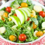 Apple And Tomato Arugula Salad: delicious summer salad with tomatoes, arugula, corn, apple and hearts of palm tossed with a homemade Mustard Vinaigrette.