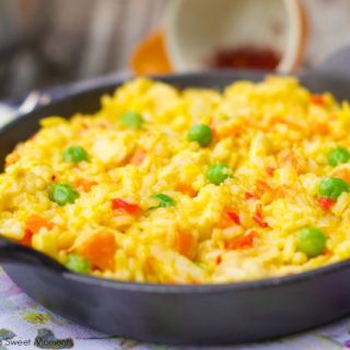 Arroz Con Pollo: Delicious latin dish made with chicken breast, veggies and saffron. Comes together in minutes and is perfect for a one pot weeknight dinner.
