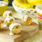 Bananas Foster Cookie Cups- chewy cookie cups filled with rice pudding and topped with homemade bananas foster. An easy to make dessert for any occasion