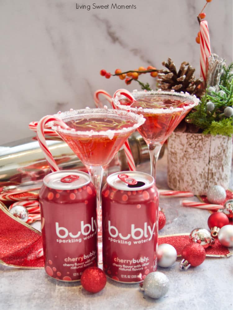 Treat yourself these Holidays with a fizzy Candy Cane Cosmopolitan mocktail that is delicious, easy to make, and great for the whole family