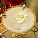 Get in the Holiday spirit with this creamy and flavorful Chai Tea Eggnog Cocktail served on a martini glass and garnished with fresh whipped cream.