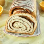 This Chai Spiced Bread is the perfect fluffy white loaf of bread, swirled with gooey chai spice and sugar in the middle topped with a sweet & tangy orange glaze