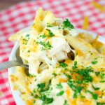 Chicken Alfredo Baked Pasta - delicious homemade Alfredo sauce tossed with pasta, cooked chicken and cheese. Perfect for a quick weeknight meal or for company.