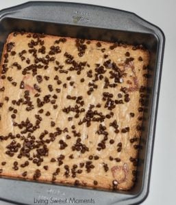 These soft and chewy Peppermint Blondies are covered in chocolate and sprinkled with candy. The perfect Holiday dessert recipe for parties and celebrations.