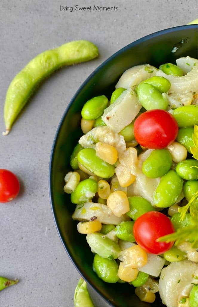 This fresh Hearts of Palm Edamame Salad has corn, cilantro, and is drizzled with an easy dijon dressing. The perfect healthy salad for any occasion.