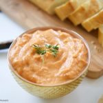 This delicious roasted red pepper Baba Ghanoush recipe is made with roasted eggplants and peppers. Makes a savory and smoky spread for bread, pitas, etc.