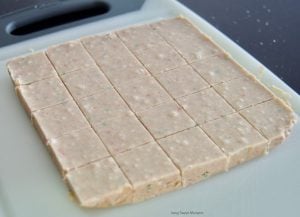 This delicious Gingerbread Holiday Fudge is perfect for Christmas parties and to give as DIY Gifts. Serve it in a present shape or decorate with sprinkles.