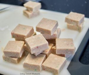 This delicious Gingerbread Holiday Fudge is perfect for Christmas parties and to give as DIY Gifts. Serve it in a present shape or decorate with sprinkles.
