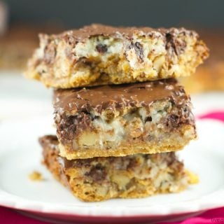 Hello Dolly Bars: these magic bars are made a graham cracker crust, chocolate chips, walnuts, cereal, coconut and more. Perfect dessert for any holiday or get together!
