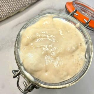 Learn how to make a sourdough starter from scratch in just 7 days that is bubbly and ready to bake. Step-by-step photos and tips included