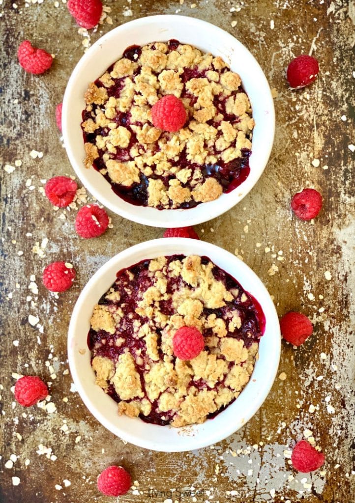 Served warm from the oven to table, this delicious Berry Crisp whips up in minutes using frozen berries. The perfect last-minute dessert that feeds a crowd