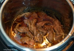 Gotta love instant pot Asian recipes! This instant pot Mongolian beef is made with flank steak & is ready in 20 minutes. Perfect for a quick weeknight meal
