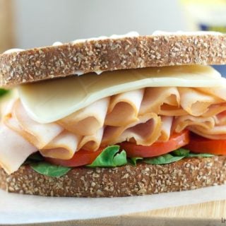 Kid Friendly Turkey Sandwich - loaded with meat, veggies, jelly and mayo for an delicious and healthy lunchbox item. Plus a great idea to send notes to kids