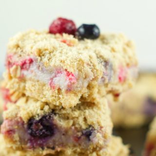 Lemon Creme Crumb Bars: Crumbly butter oatmeal crust with a citrus berry creme filling. These bars are the perfect summer dessert for any occasion