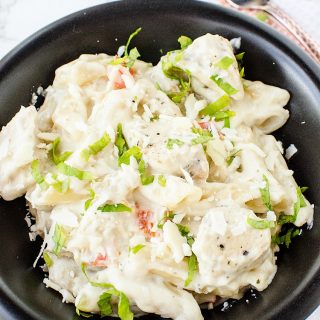 This creamy Lemon Slow Cooker Chicken Pasta recipe is super easy to make and is perfect to feed a crowd. Enjoy a delicious weeknight meal or dinner.