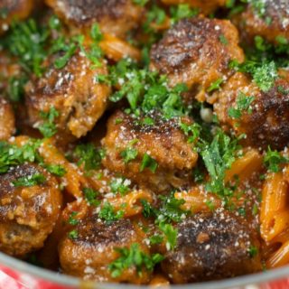 One Pan Pasta And Meatballs: the perfect one pot meal dinner idea! Tender homemade meatballs are cooked inside a tomato basil sauce served with penne pasta.